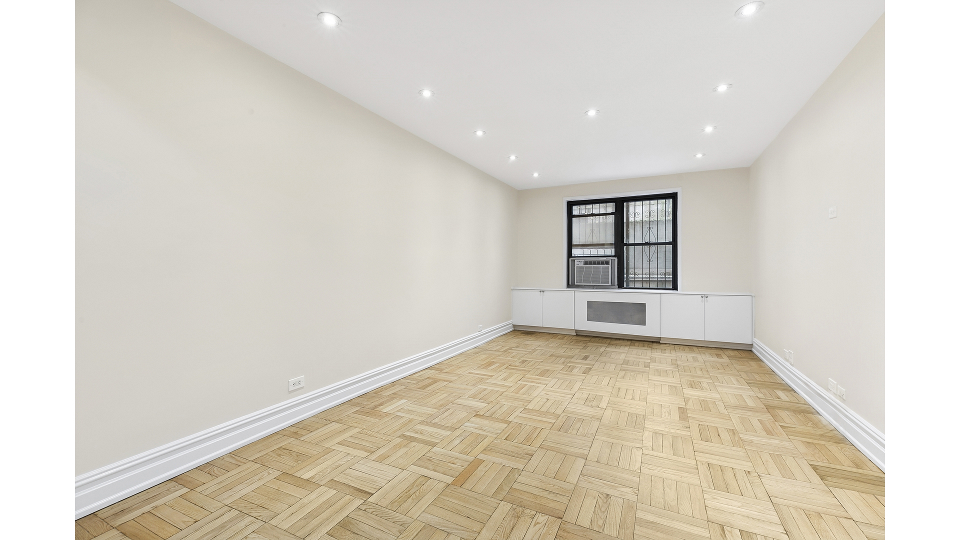 345 Riverside Drive, Unit 1E Manhattan, NY 10025 - Photo 14 of 15 a view of an empty room with a window