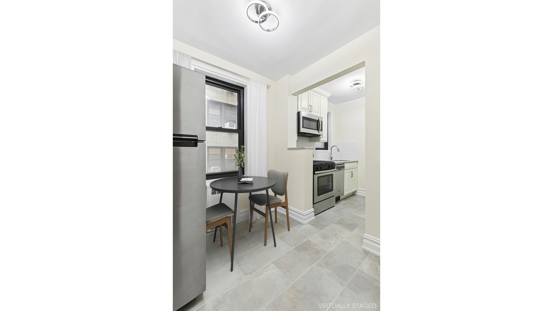 345 Riverside Drive, Unit 1E Manhattan, NY 10025 - Photo 3 of 15 a workspace room with table and chairs