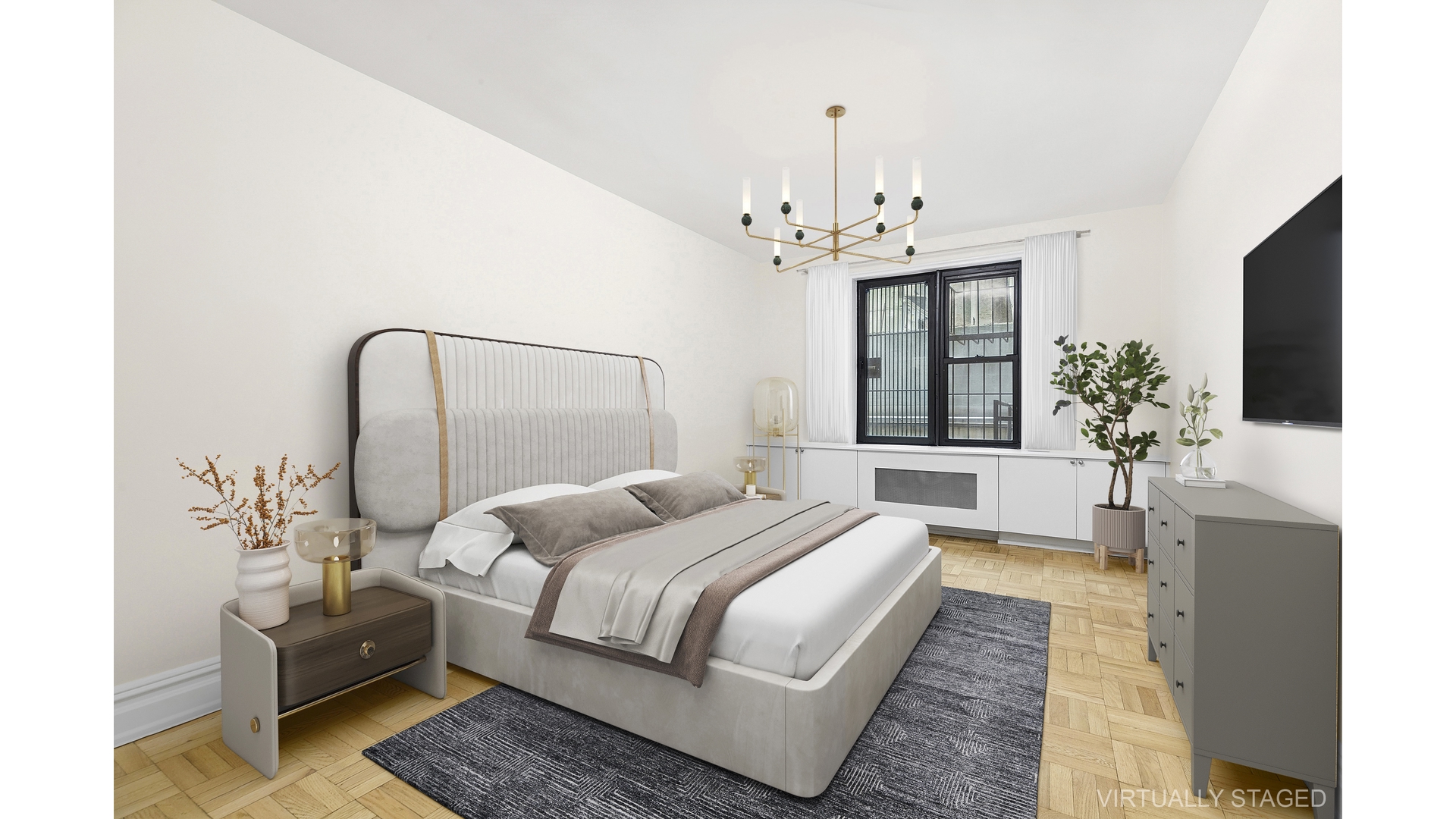 345 Riverside Drive, Unit 1E Manhattan, NY 10025 - Photo 5 of 15 a bedroom with a large bed and a chandelier