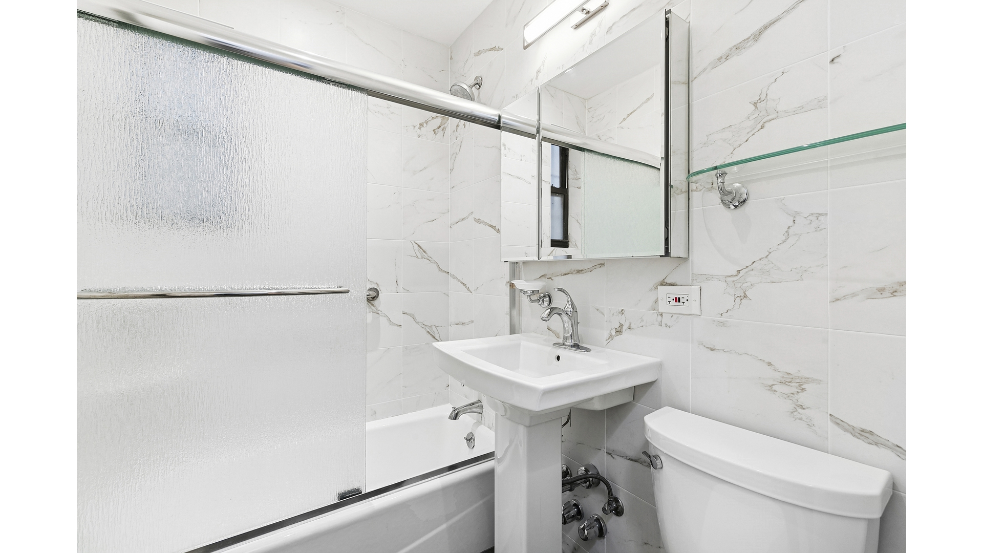 345 Riverside Drive, Unit 1E Manhattan, NY 10025 - Photo 6 of 15 a bathroom with a sink a toilet and shower