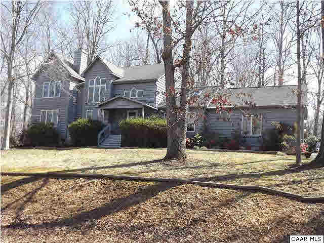 61 Dogleg Road Palmyra, VA 22963 - Photo 1 of 39 a front view of a house with a yard covered with snow