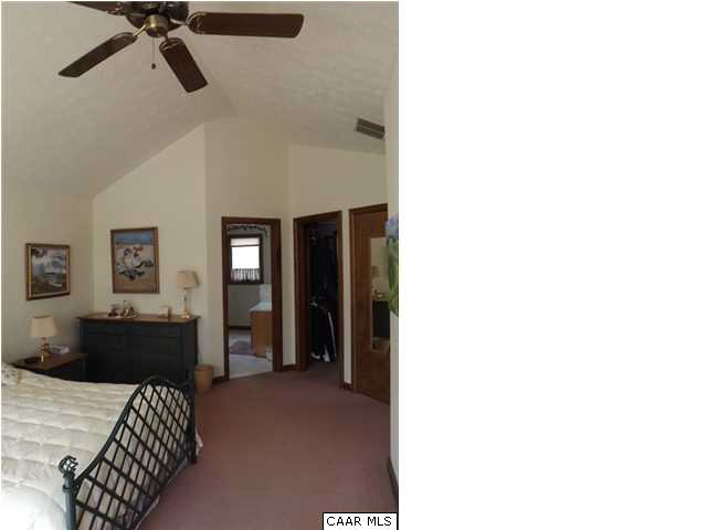 61 Dogleg Road Palmyra, VA 22963 - Photo 19 of 39 a bedroom with a bed and dresser