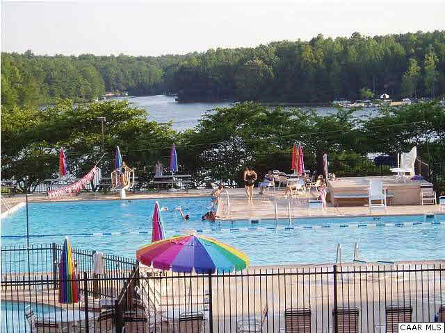 61 Dogleg Road Palmyra, VA 22963 - Photo 23 of 39 a view of a swimming pool with a patio and a garden