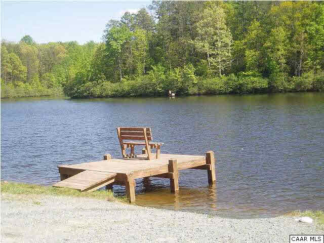 61 Dogleg Road Palmyra, VA 22963 - Photo 33 of 39 a view of a lake with couches chairs