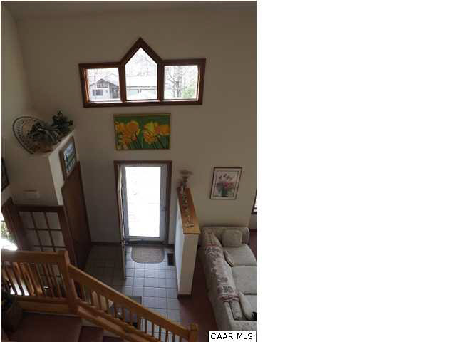 61 Dogleg Road Palmyra, VA 22963 - Photo 8 of 39 a view of hallway with a large window and wooden floor