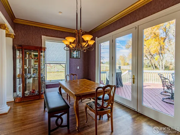 a room with furniture pool table table and chairs
