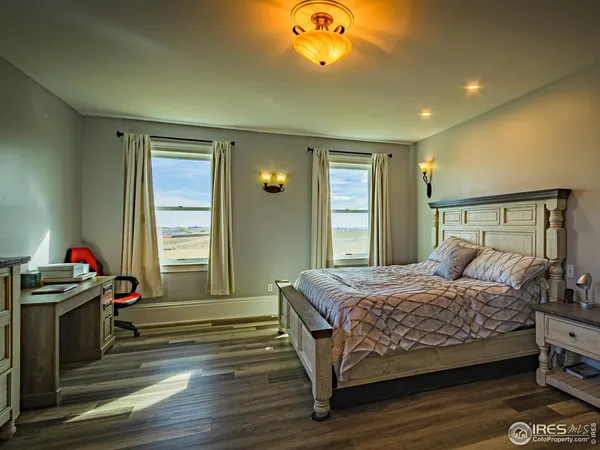 a bedroom with a bed and a fireplace