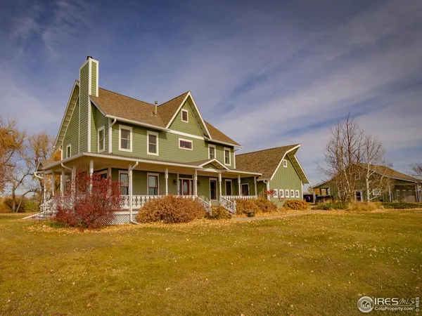 a view of a house with wooden deck