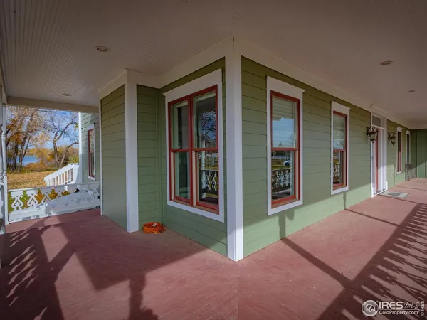 a view of staircase with wooden floor and a rug
