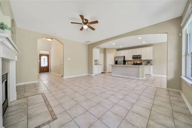 a view of a kitchen with a sink and cabinets