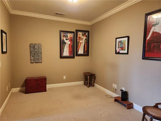 a view of an empty room with windows