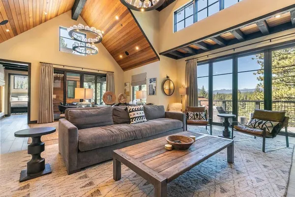 a bathroom with a tub a sink and mirror