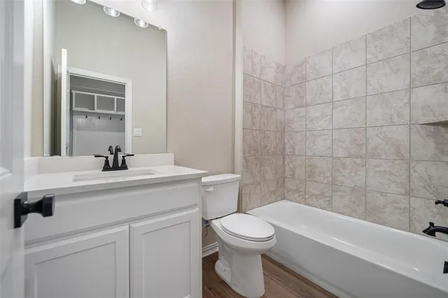 a view of cabinets and wooden floor