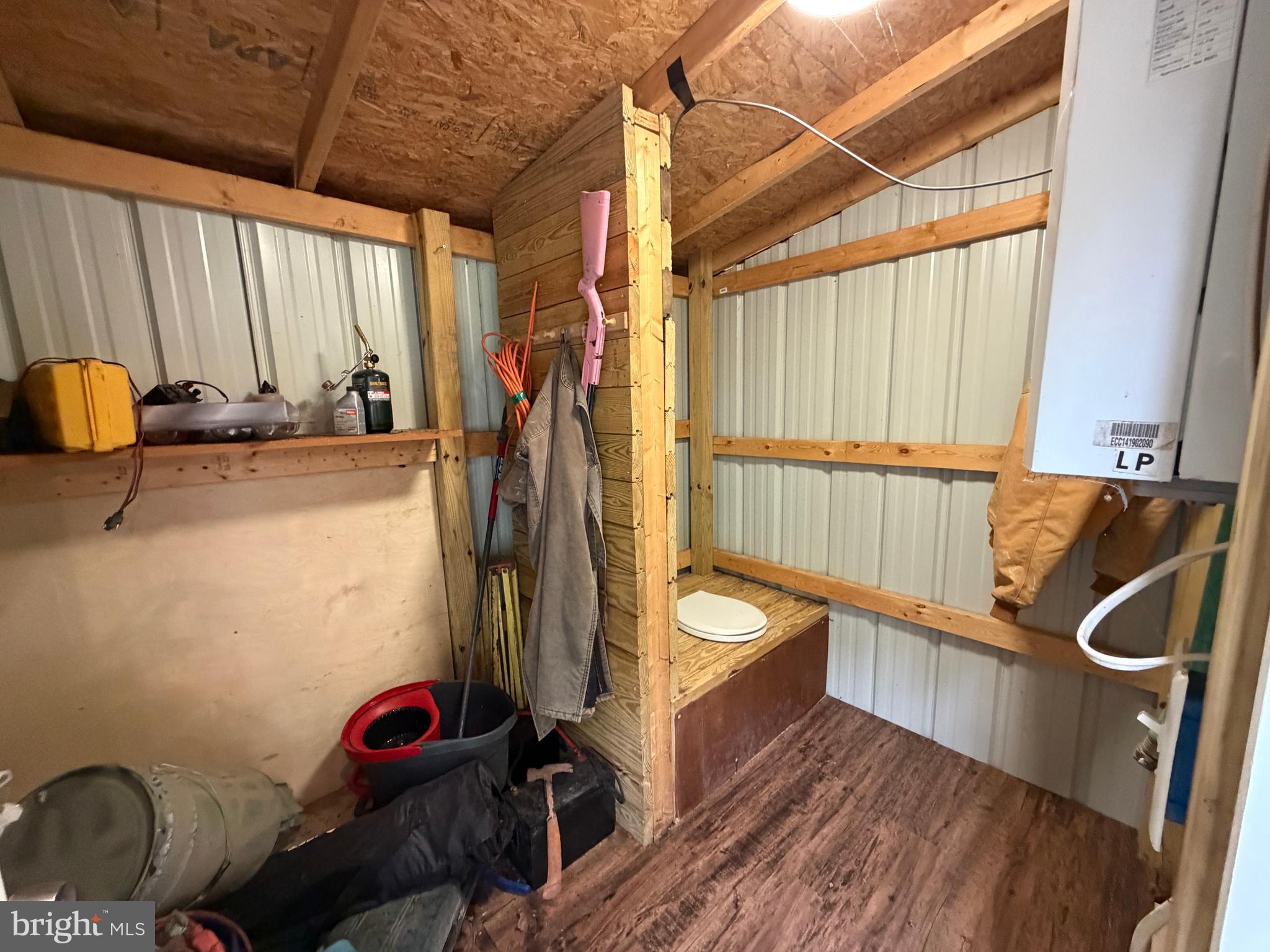 1419 Paul's Woods Road Delray, WV 26714 - Photo 38 of 105 a view of a room with shelves and wooden floor