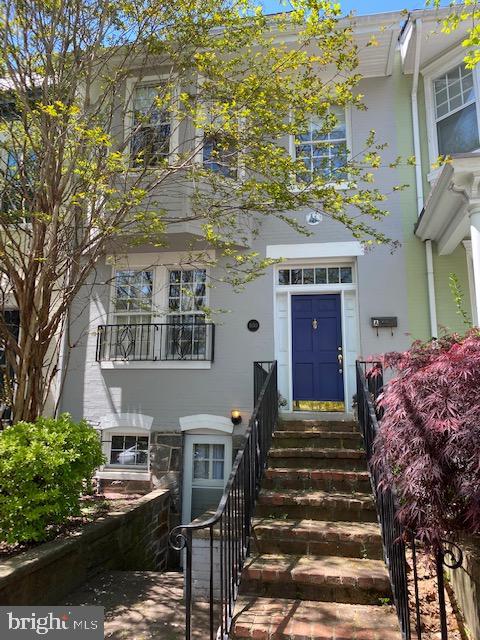 1650 33rd Street Northwest, Unit B Washington, DC 20007 - Photo 1 of 5 Charming entrance with vibrant greenery.