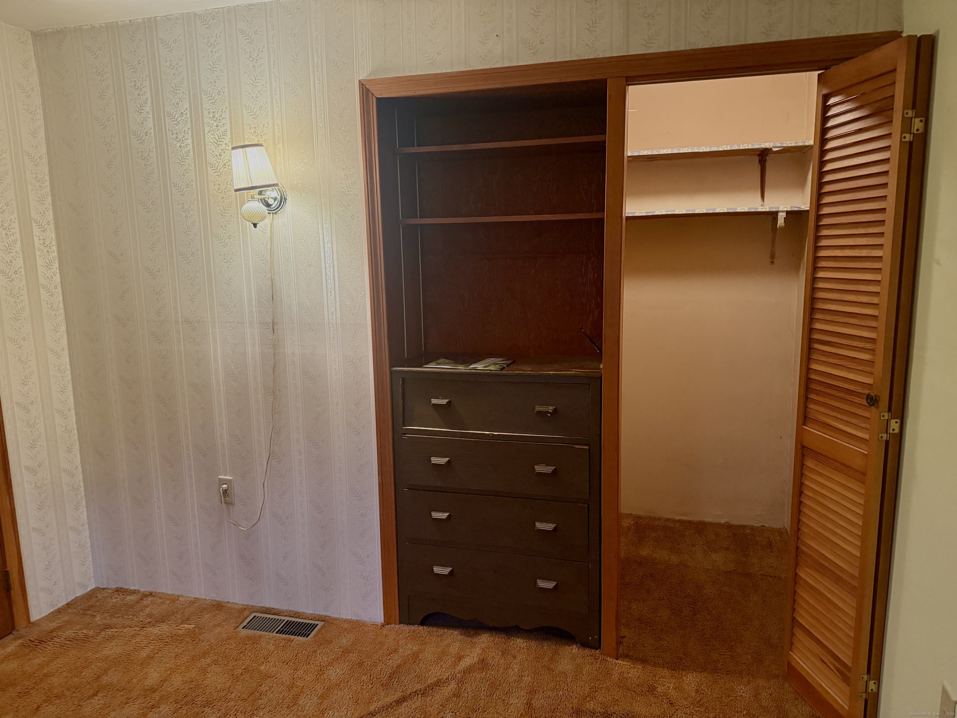 16 Naugatuck Avenue Shelton, CT 06484 - Photo 15 of 36 a bedroom with a dresser and a window