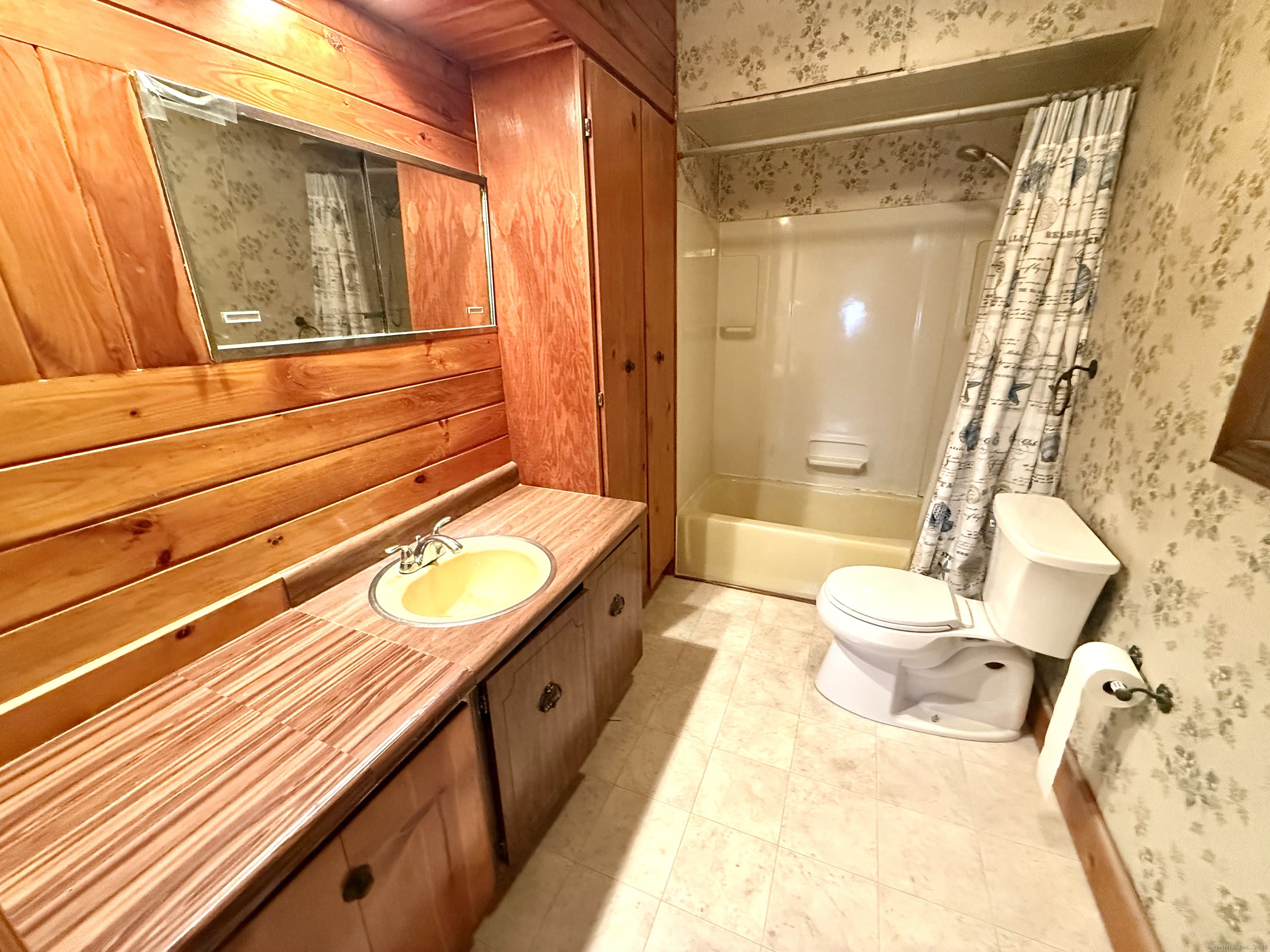 16 Naugatuck Avenue Shelton, CT 06484 - Photo 17 of 36 a bathroom with a granite countertop sink and a mirror