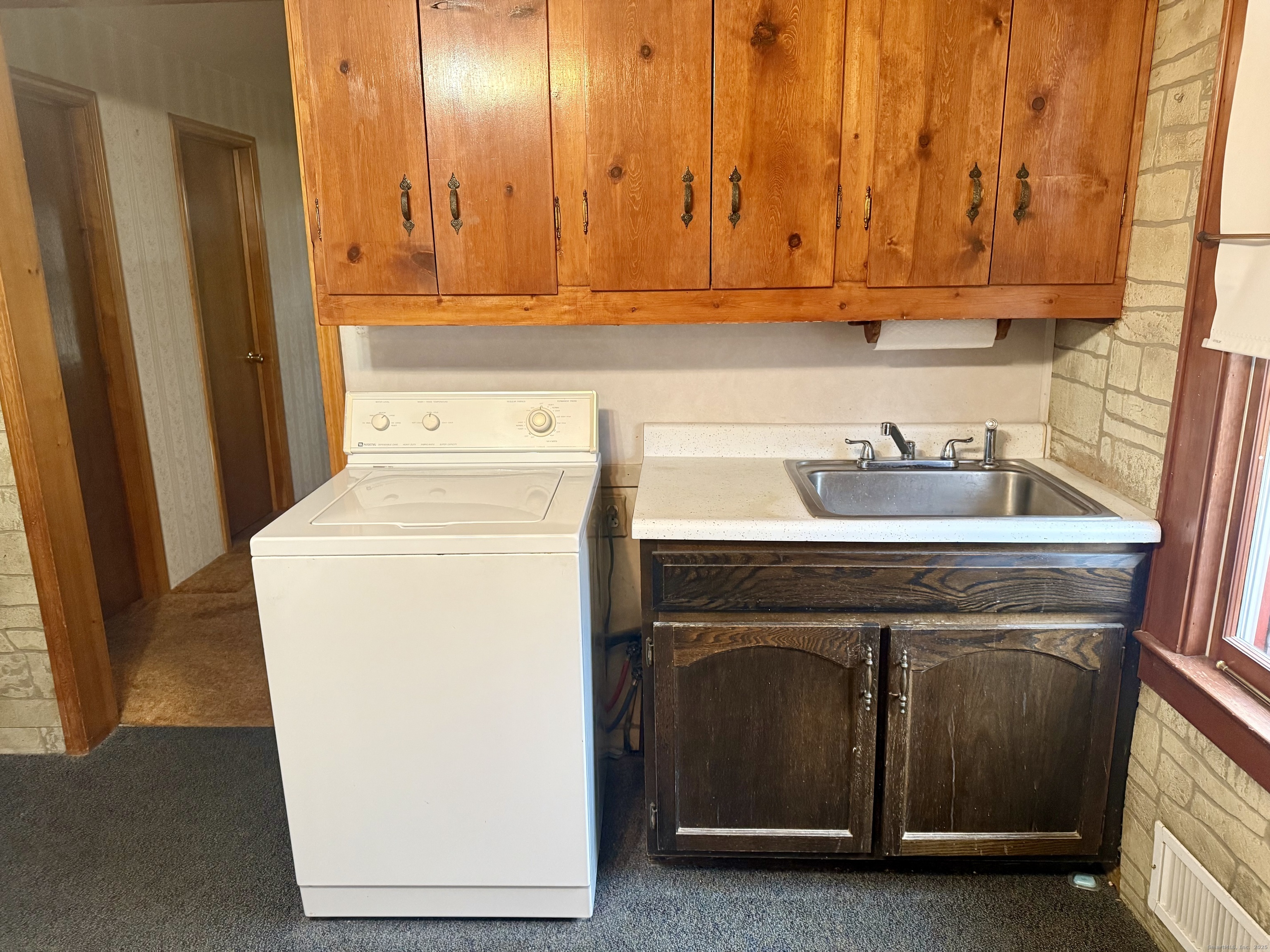 16 Naugatuck Avenue Shelton, CT 06484 - Photo 9 of 36 a bathroom with a sink and a washer dryer