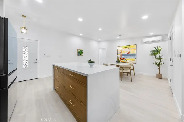 a spacious bathroom with a sink a mirror and a bathtub