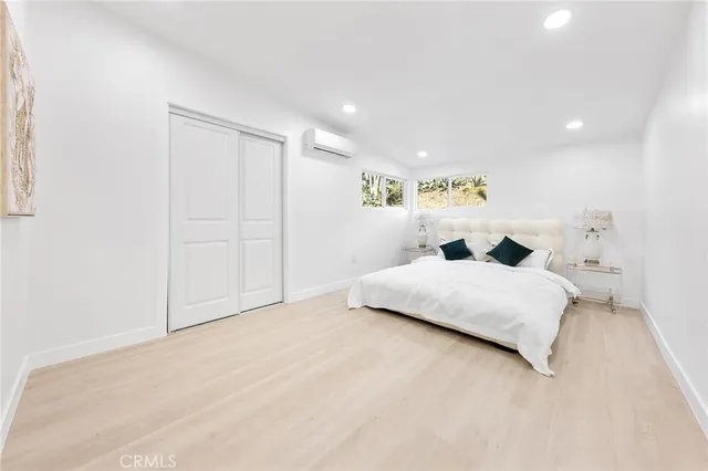 a large white bed in a white room