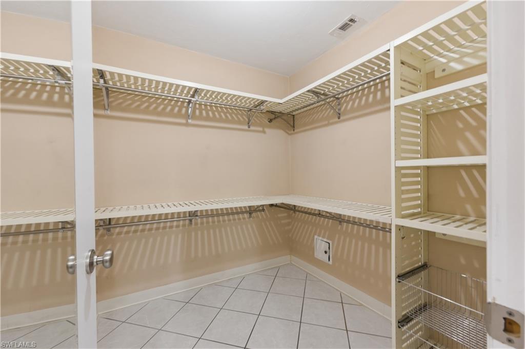 4031 Ice Castle Way, Unit 3306 Naples, FL 34112 - Photo 15 of 25 Walk in closet featuring light tile patterned flooring