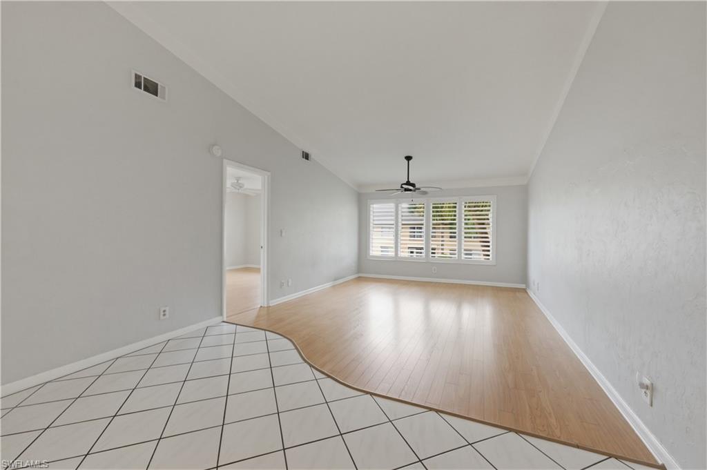 4031 Ice Castle Way, Unit 3306 Naples, FL 34112 - Photo 8 of 25 Great room with ornamental molding, light tile patterned floors, and a ceiling fan