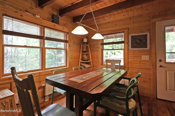 a view of a dining room with furniture and window