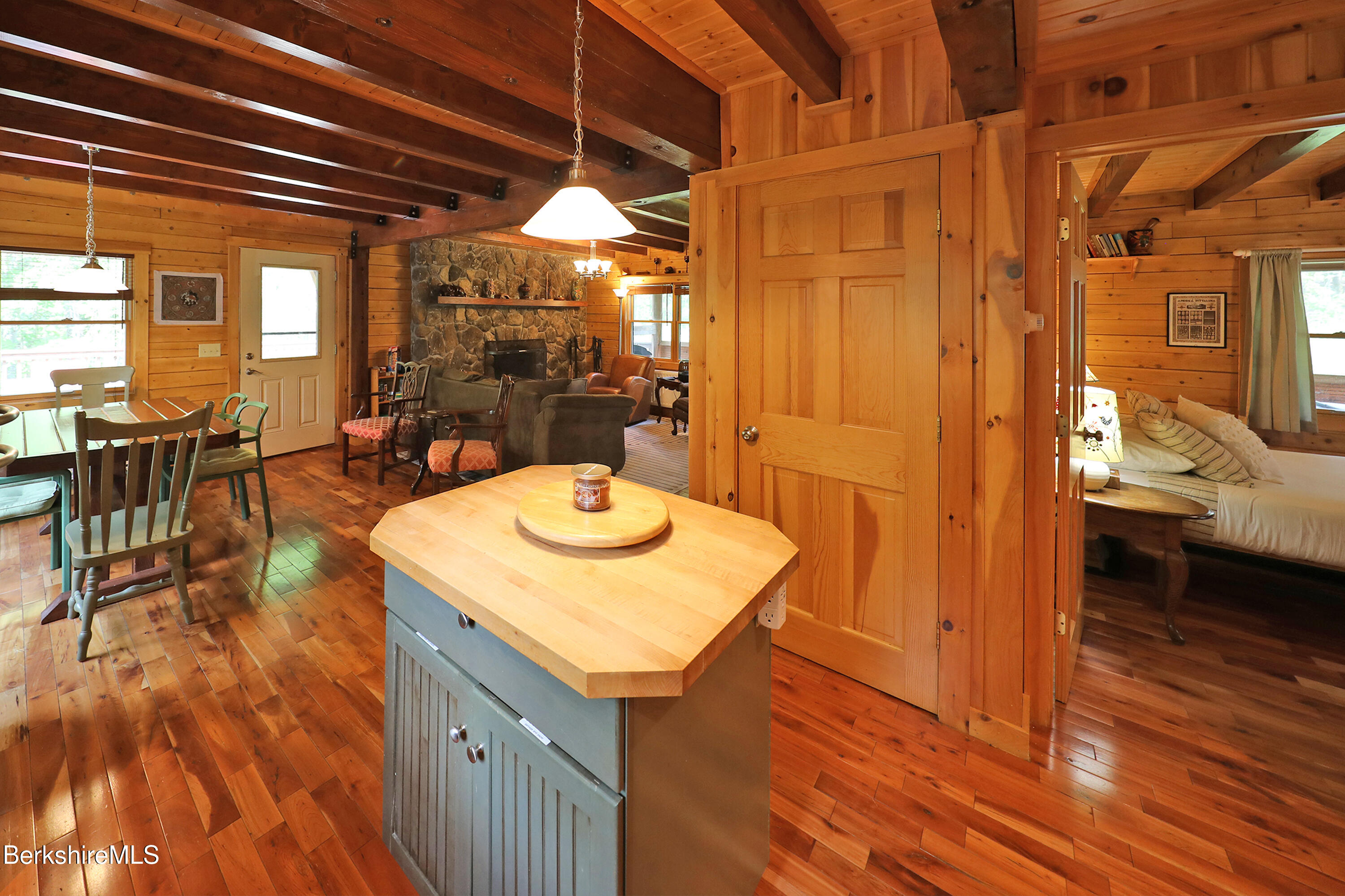 235 Algerie Road Becket, MA 01223 - Photo 13 of 43 a view of a dining room with furniture and chandelier