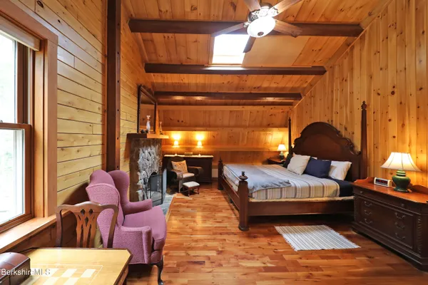 a bedroom with furniture and a window