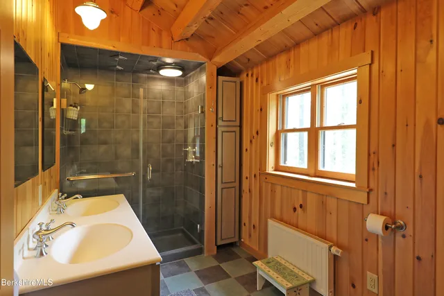 a bathroom with a tub and shower