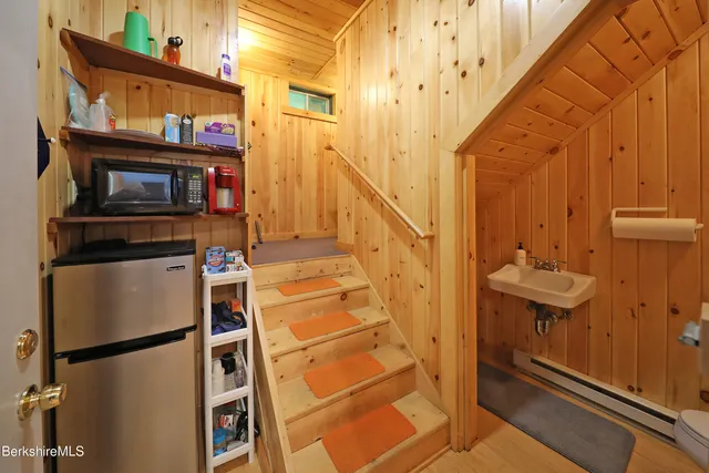 a view of living room with furniture and a fireplace