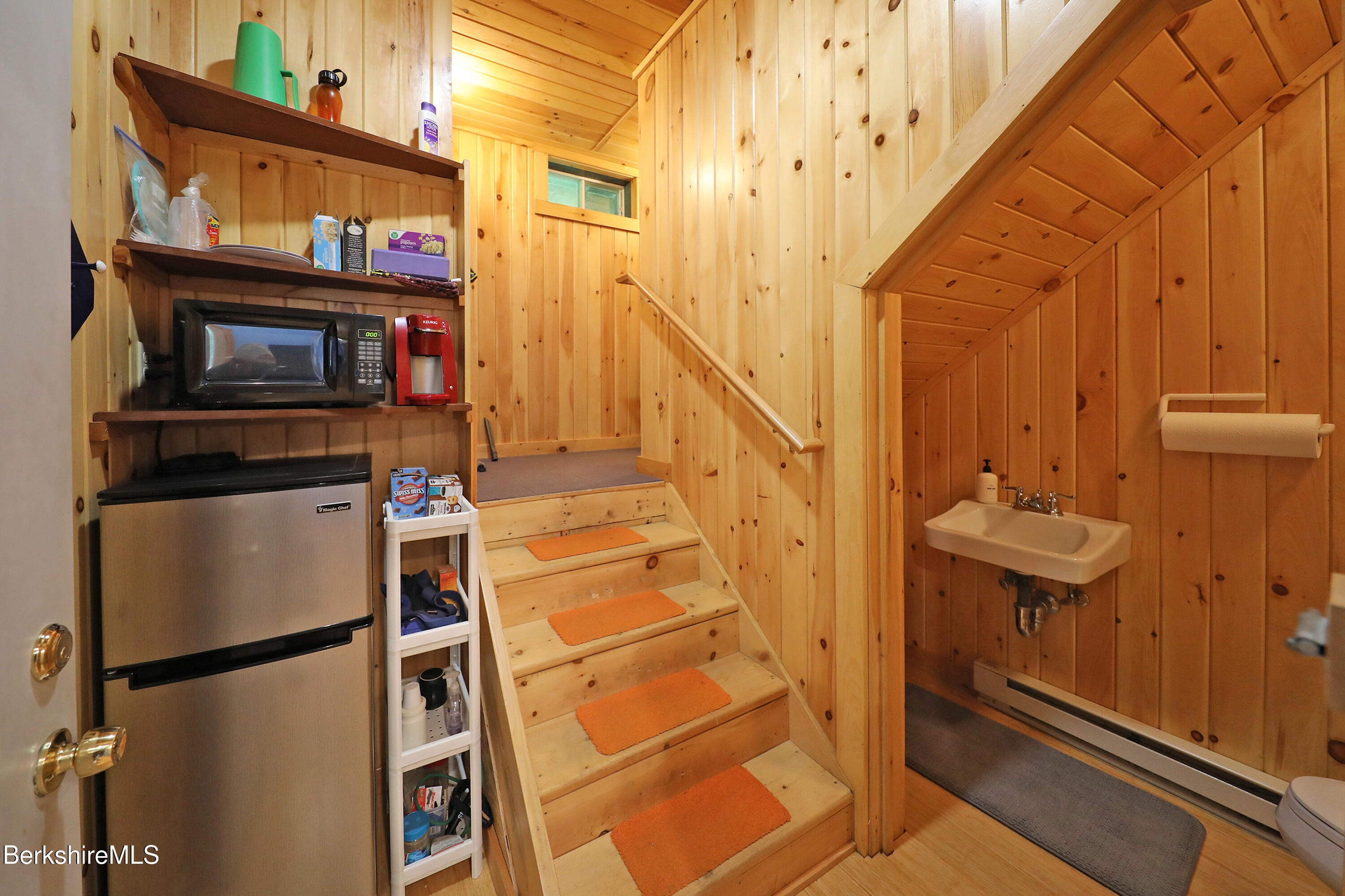 235 Algerie Road Becket, MA 01223 - Photo 31 of 43 a view of living room with furniture and a fireplace