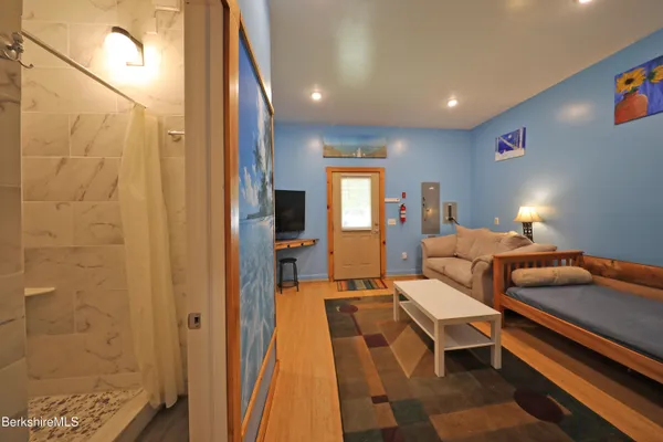 a living room with a couch and a flat screen tv