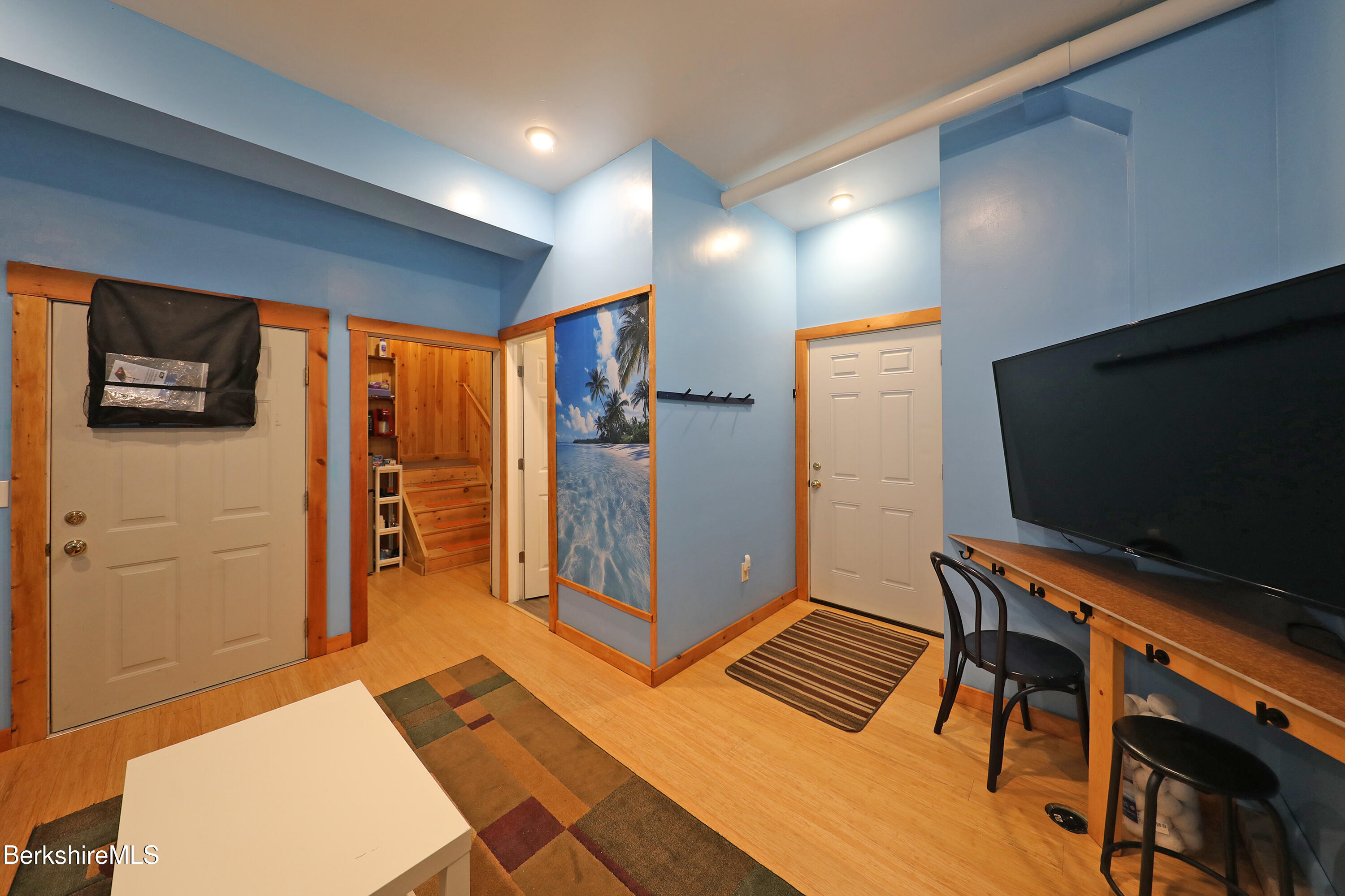 235 Algerie Road Becket, MA 01223 - Photo 34 of 43 a living room with furniture and a flat screen tv