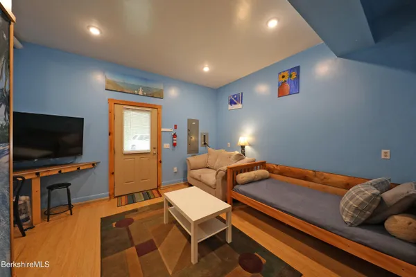 a living room with furniture and a flat screen tv