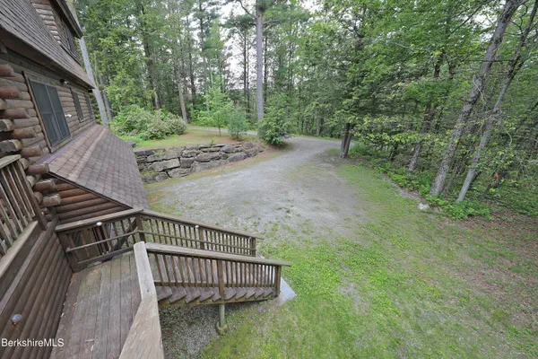 a view of a backyard with trees