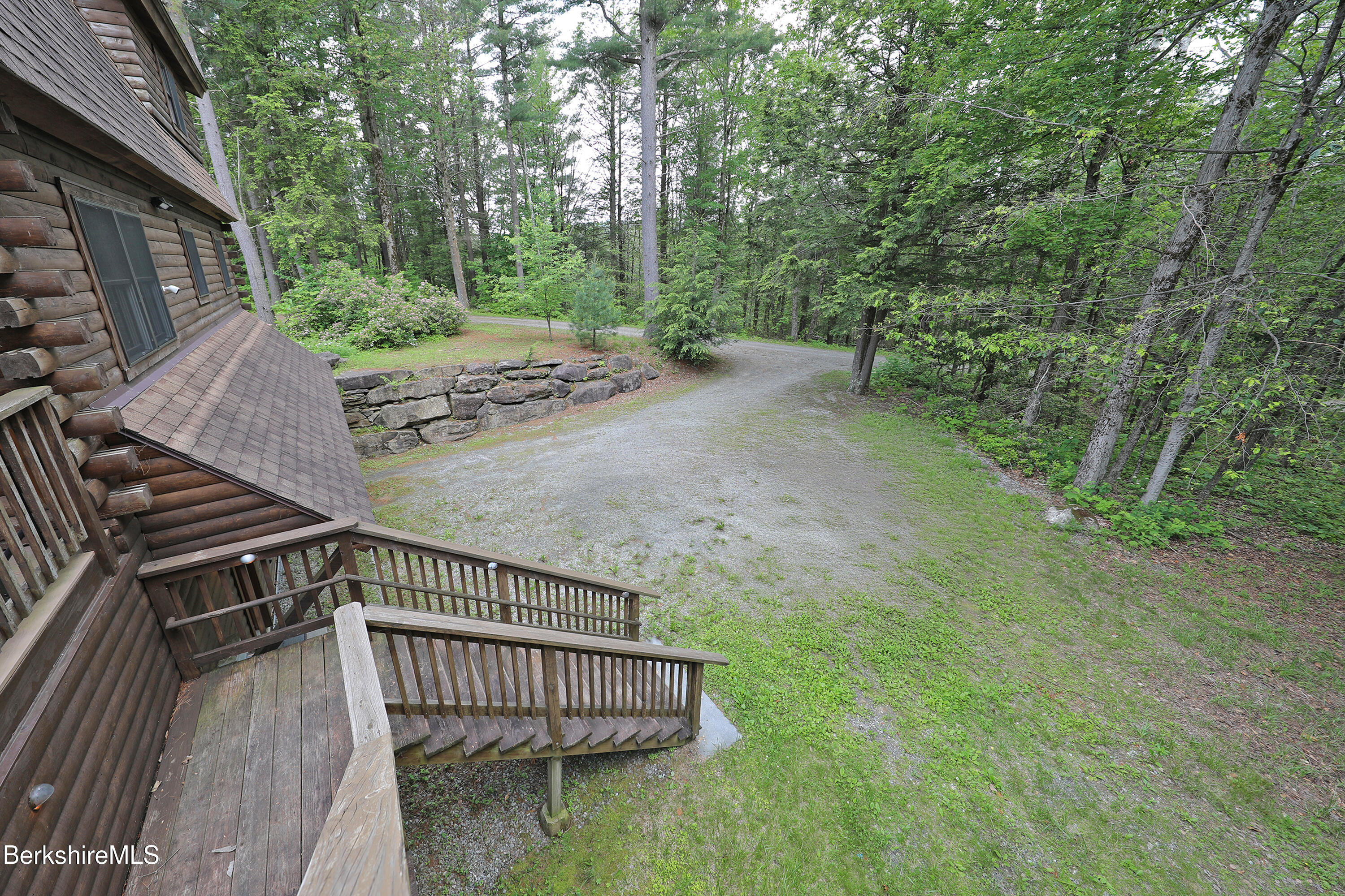 235 Algerie Road Becket, MA 01223 - Photo 38 of 43 a view of a backyard with trees