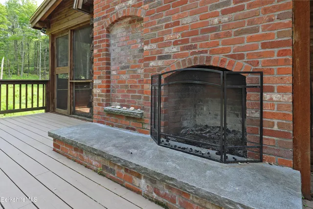 a brick building with a bench in front