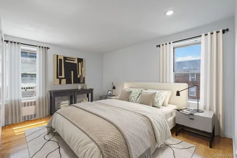 a bed room with a bed and a window