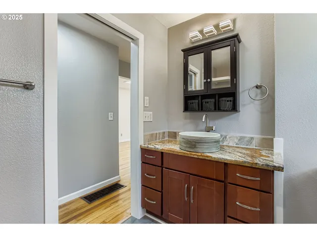 a picture of a bathroom with a shower