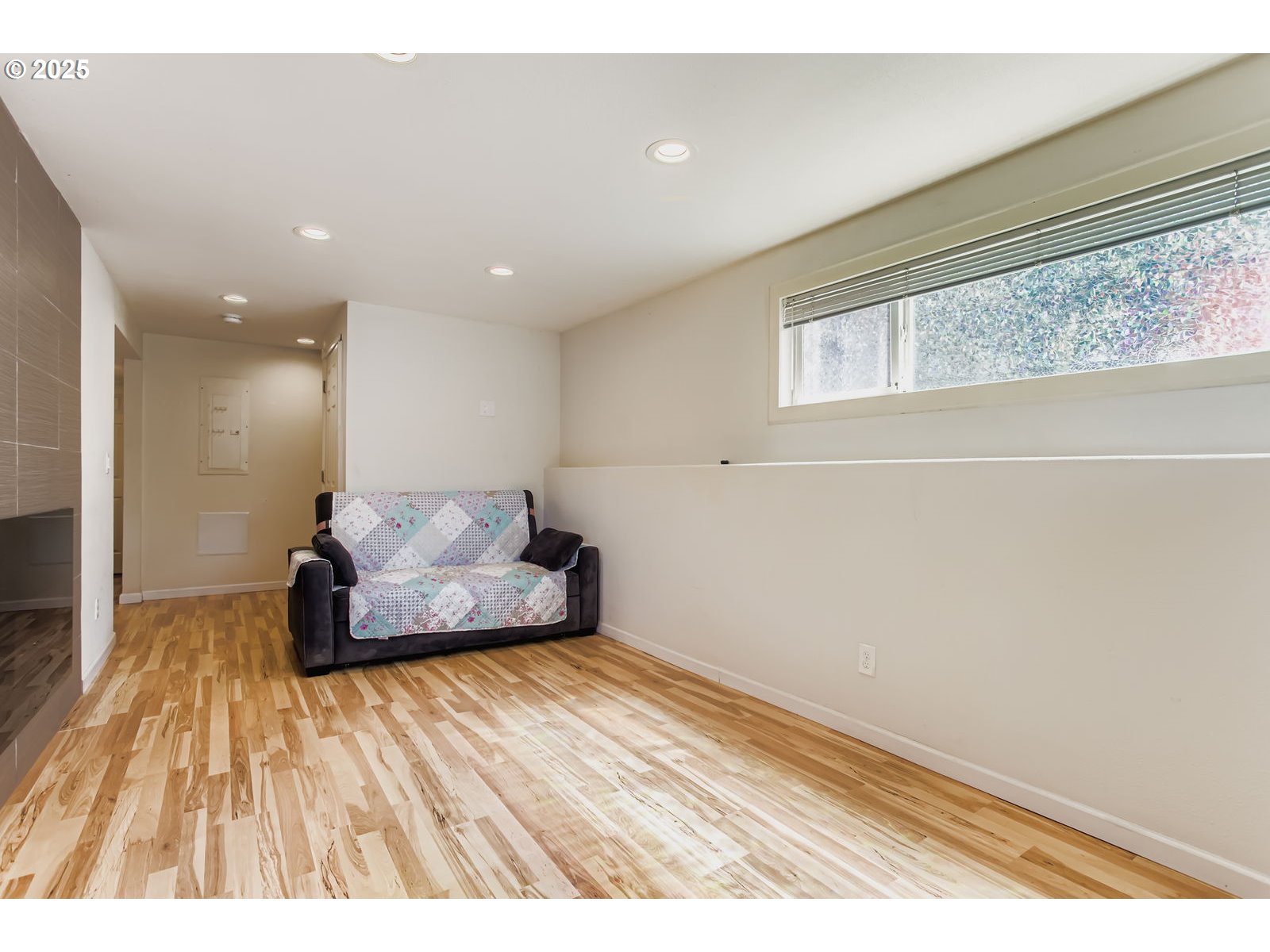 14555 Northeast Knott Court Portland, OR 97230 - Photo 18 of 40 a living room with a bed furniture and a wooden floor