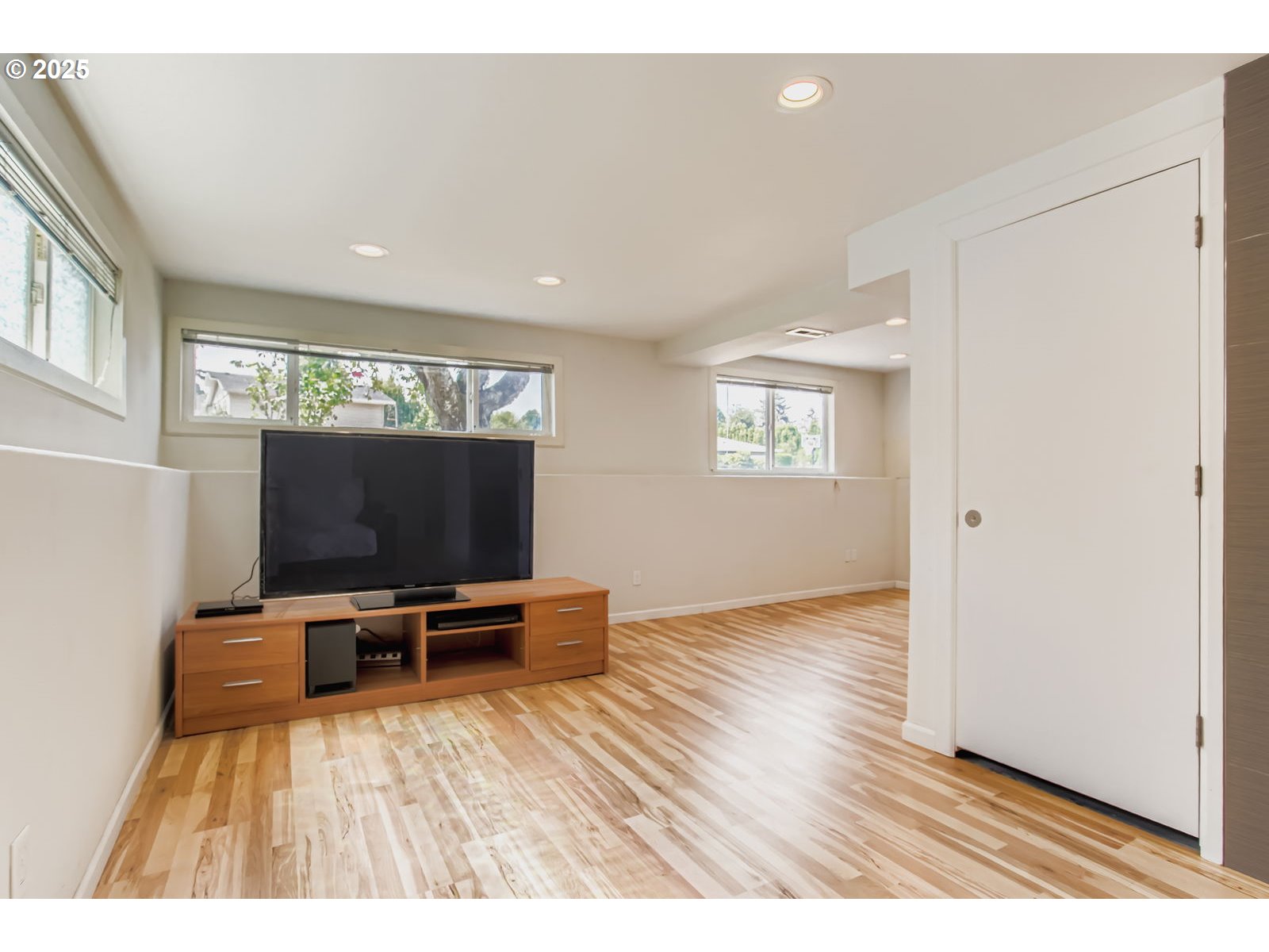 14555 Northeast Knott Court Portland, OR 97230 - Photo 19 of 40 a view of a livingroom with furniture and a flat screen tv