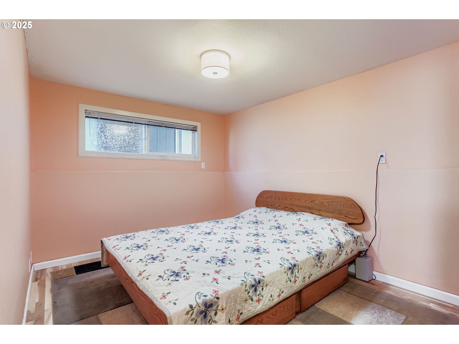14555 Northeast Knott Court Portland, OR 97230 - Photo 24 of 40 a bedroom with a bed and wooden floor