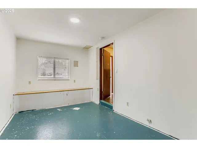 a kitchen with stainless steel appliances granite countertop a sink and a refrigerator