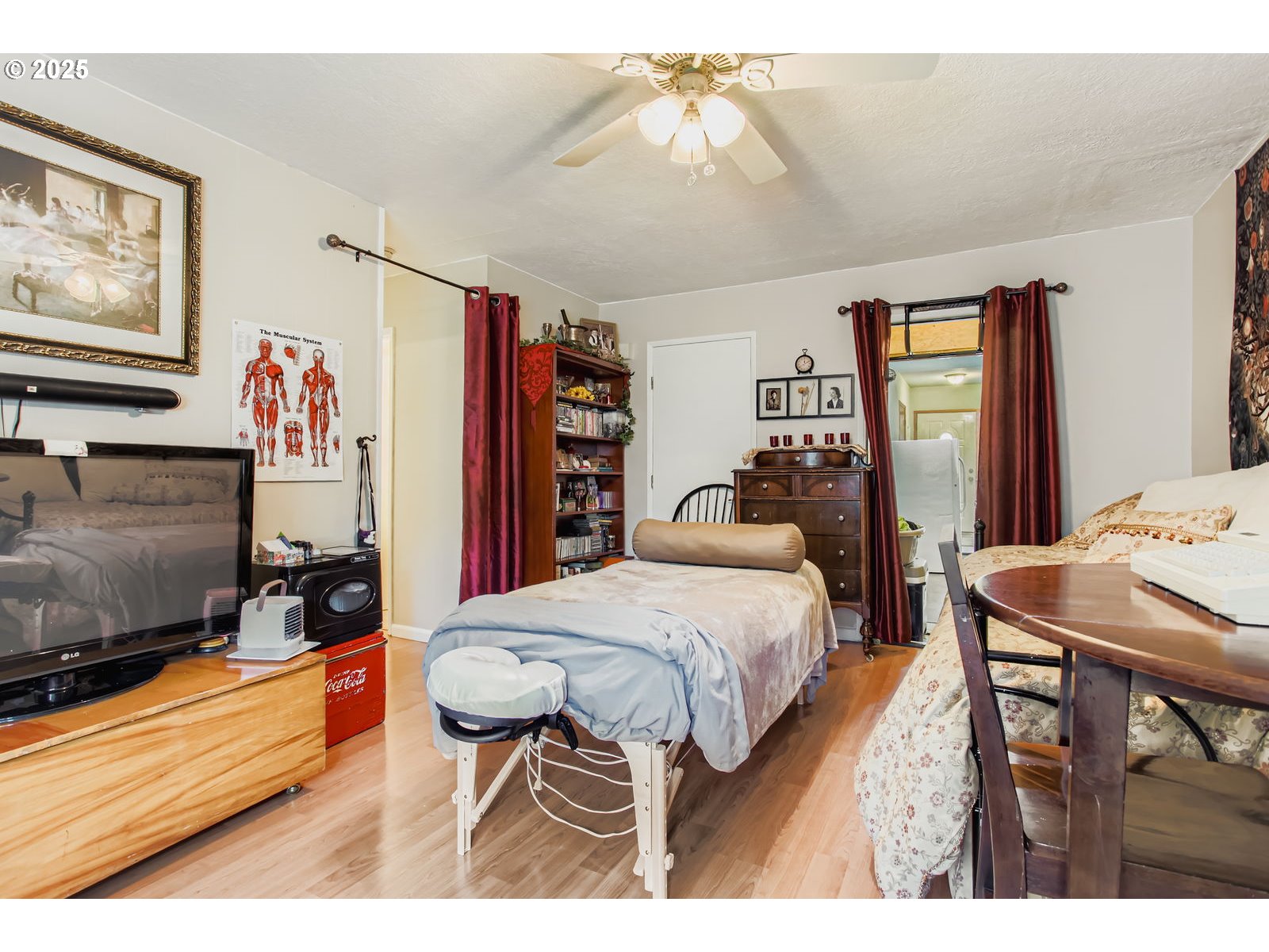 14555 Northeast Knott Court Portland, OR 97230 - Photo 31 of 40 a bedroom with a bed and a flat screen tv