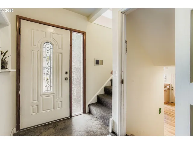 a kitchen with stainless steel appliances a stove a sink and a refrigerator