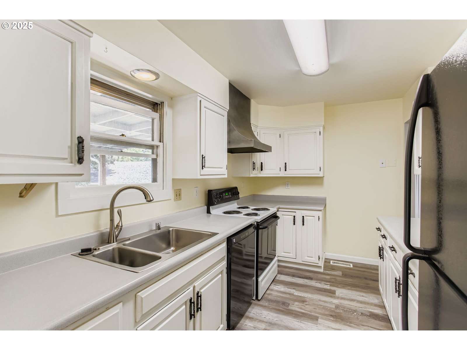 14555 Northeast Knott Court Portland, OR 97230 - Photo 6 of 40 a kitchen with a sink appliances and cabinets