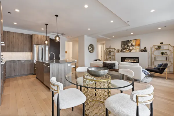 a living room with fireplace furniture and a wooden floor