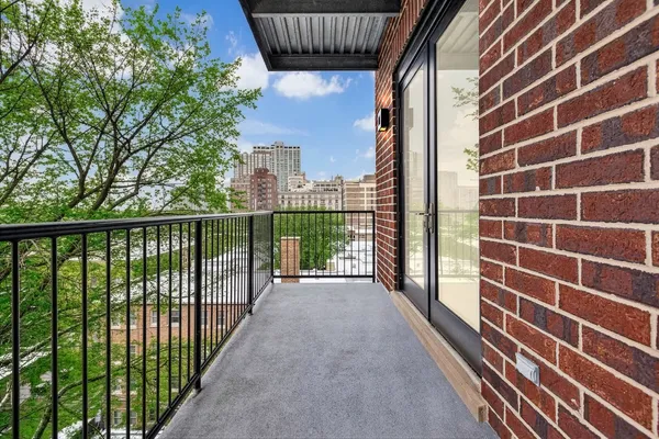 a view of a brick wall from a balcony