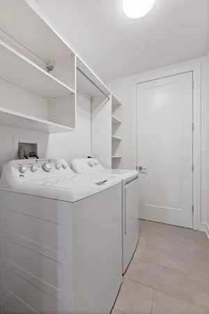 a room with a sink and cabinets